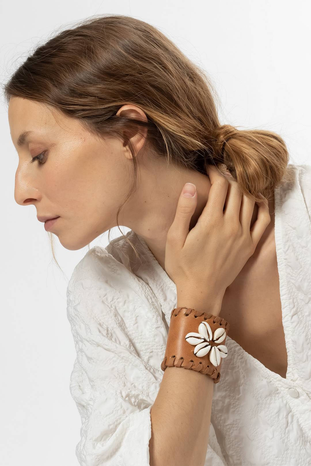 Hand Matters. Brown leather bracelet with snails