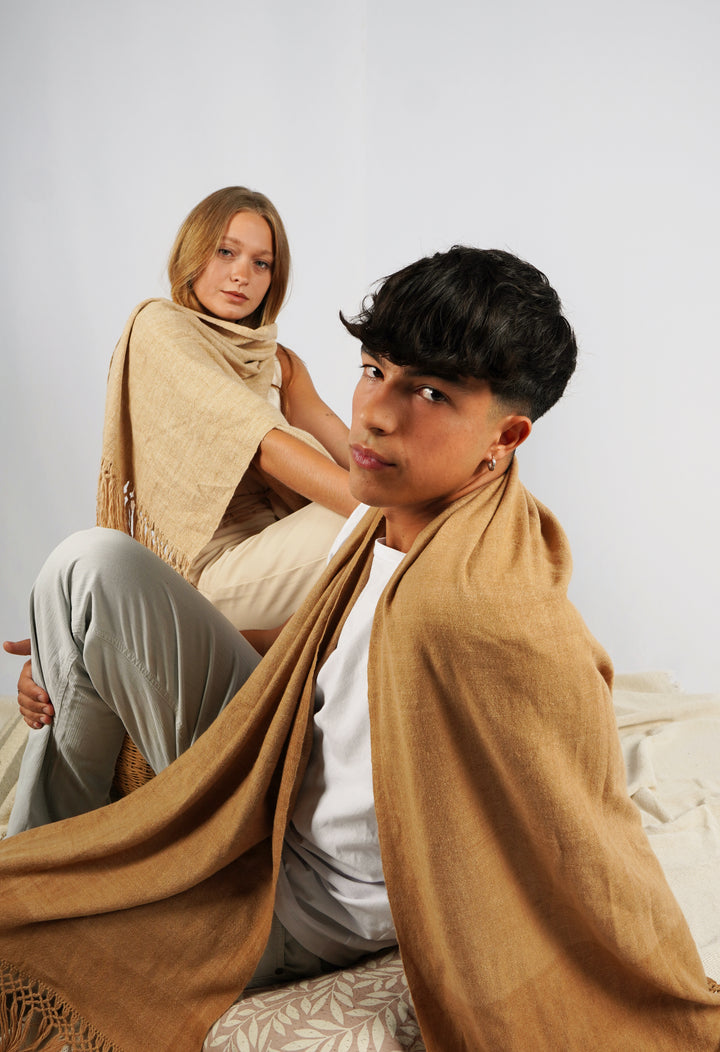 Hand Matters. Ecru and brown vicuña ponchos from Argentina