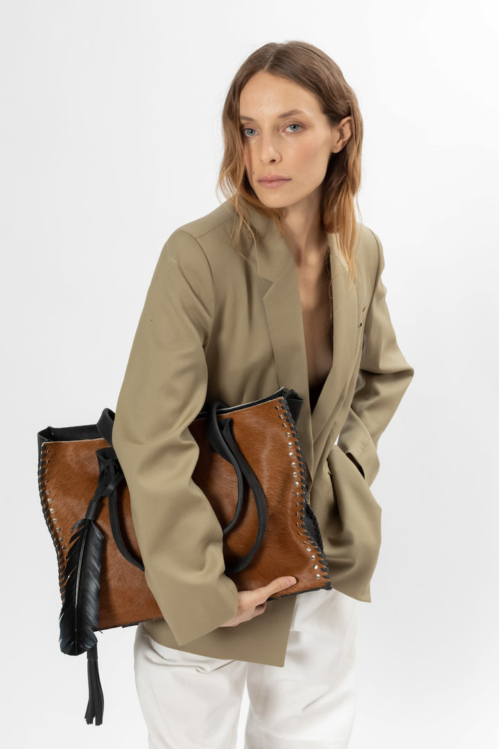 Cool feather bag. Hand Matters