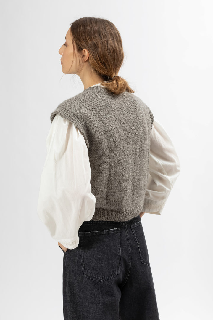 Hand Matters. Grey llama vests