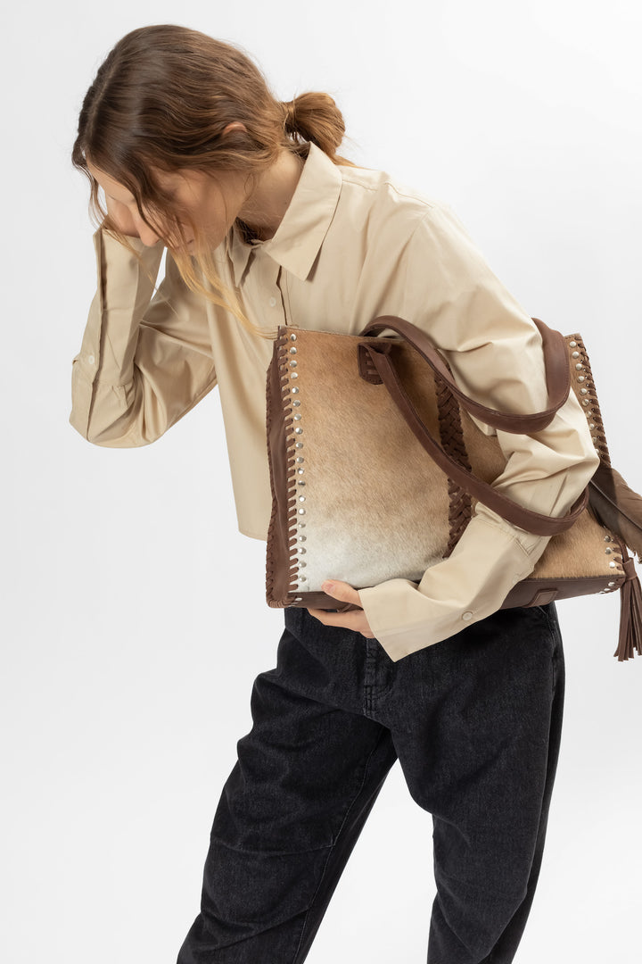 Hand Matters. Soft brown feather handbag
