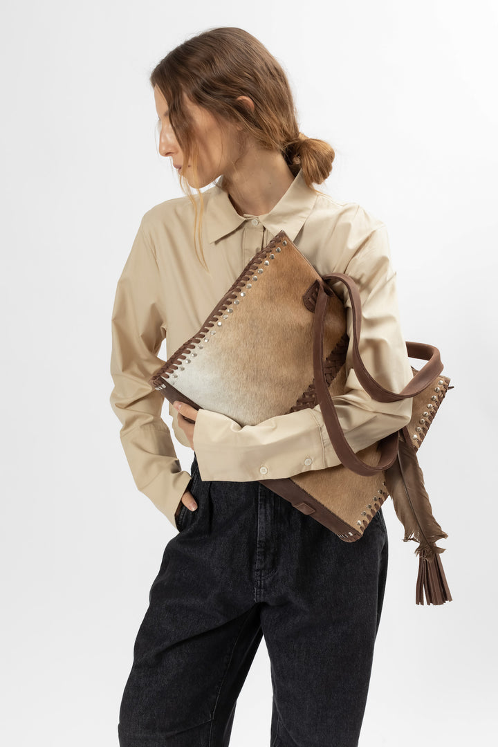 Hand Matters. Soft brown large feather handbag