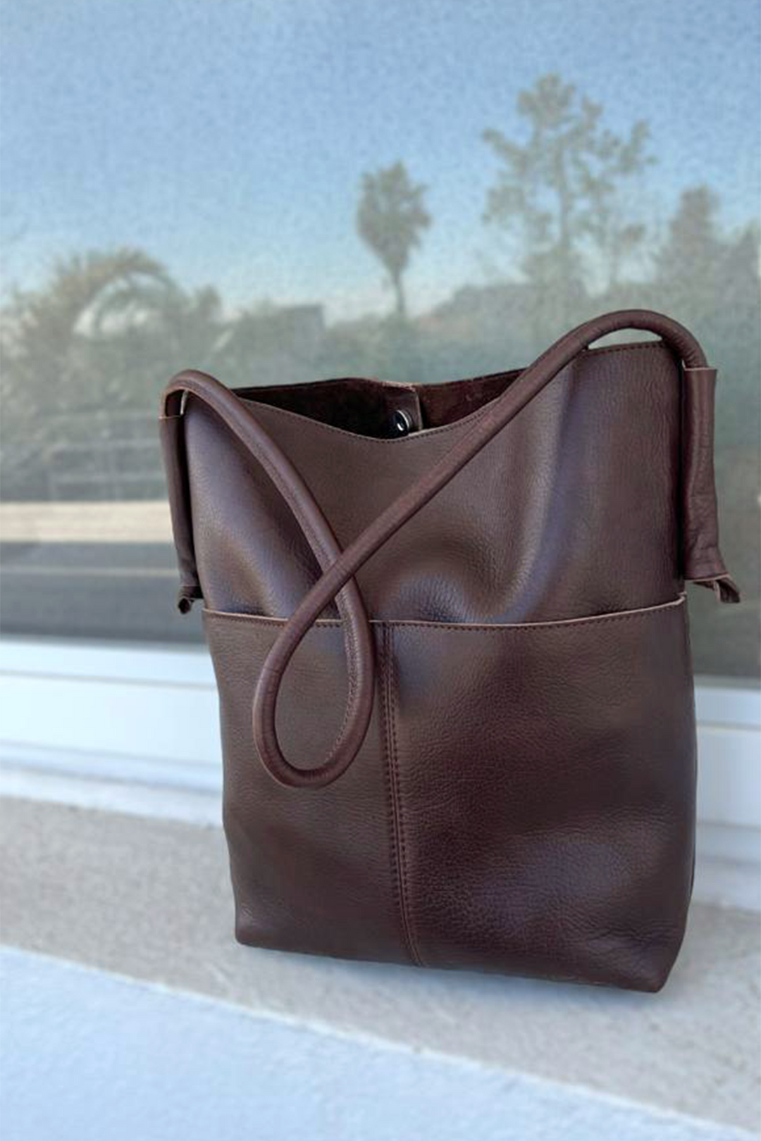 Hand matters compact leather bag