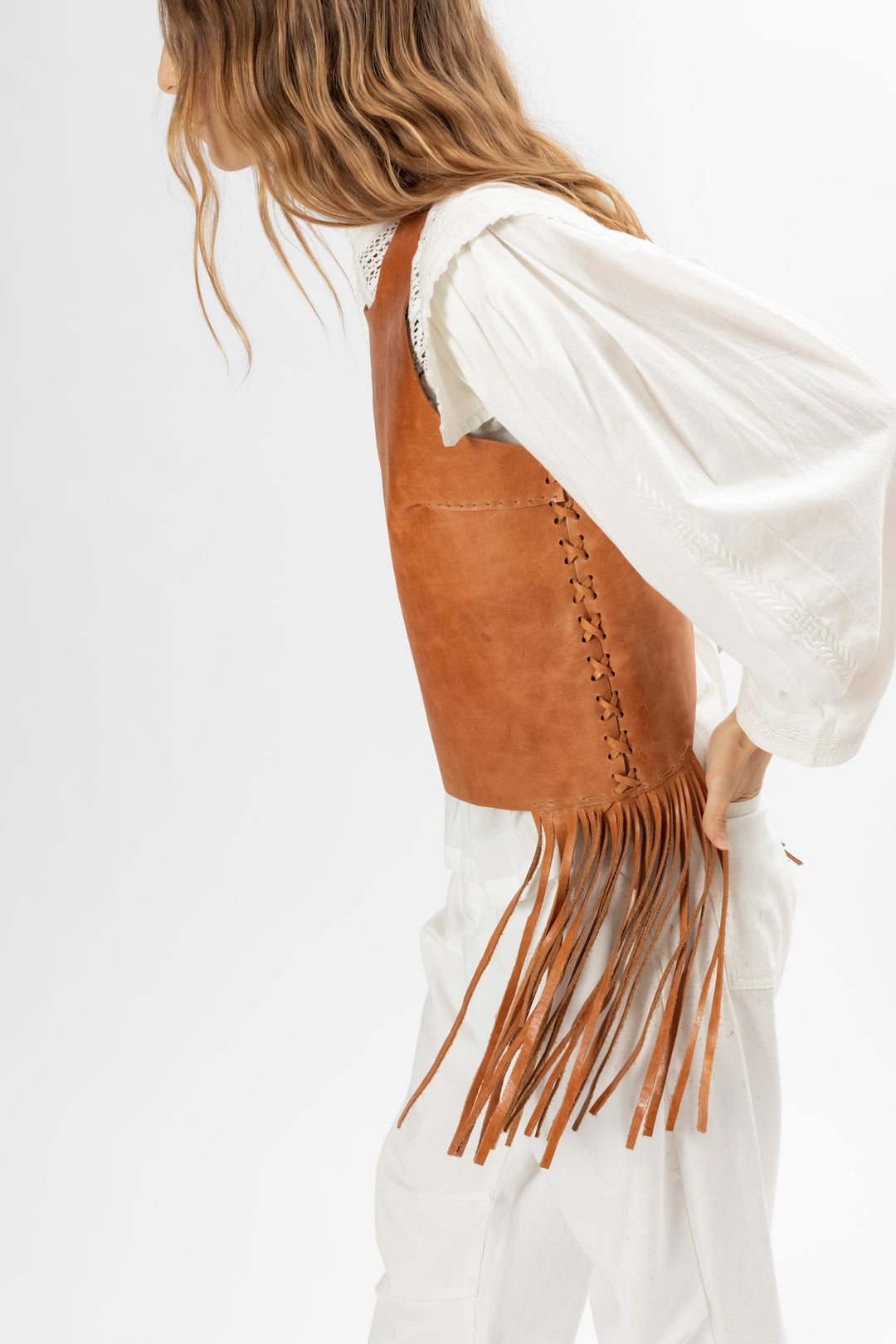 Leather top with fringes. Hand Matters.