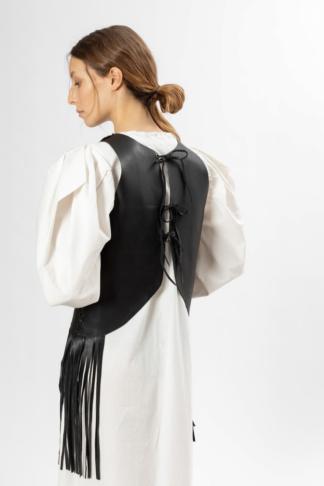 Hand Matters. Black leather top with fringes